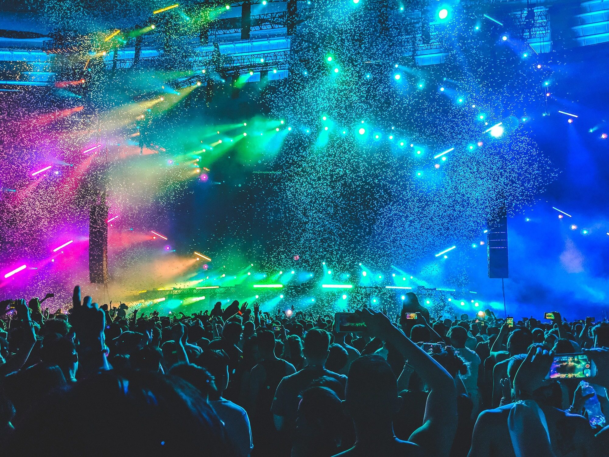 Colorful live concert production with a large audience